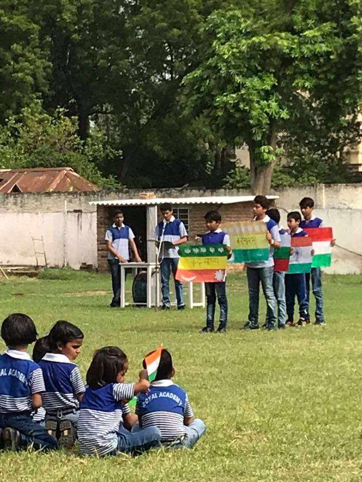 Royal Academy Alwar students displaying patriotic cards
