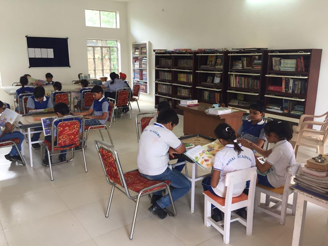 Royal Academy Alwar students reading in the school library
